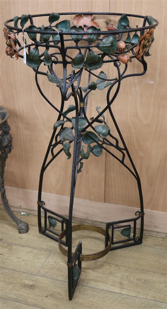 An early 20th century wrought iron plant stand W.61cm